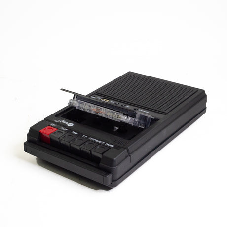 Flat black cassette player with a cassettetape